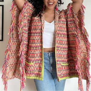 Geometric pattern multicolored poncho with sleeves, tassles, hood and pockets!